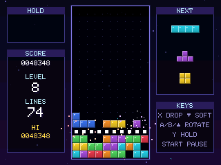 Blockfall gameplay: coloured blocks stacking in a well